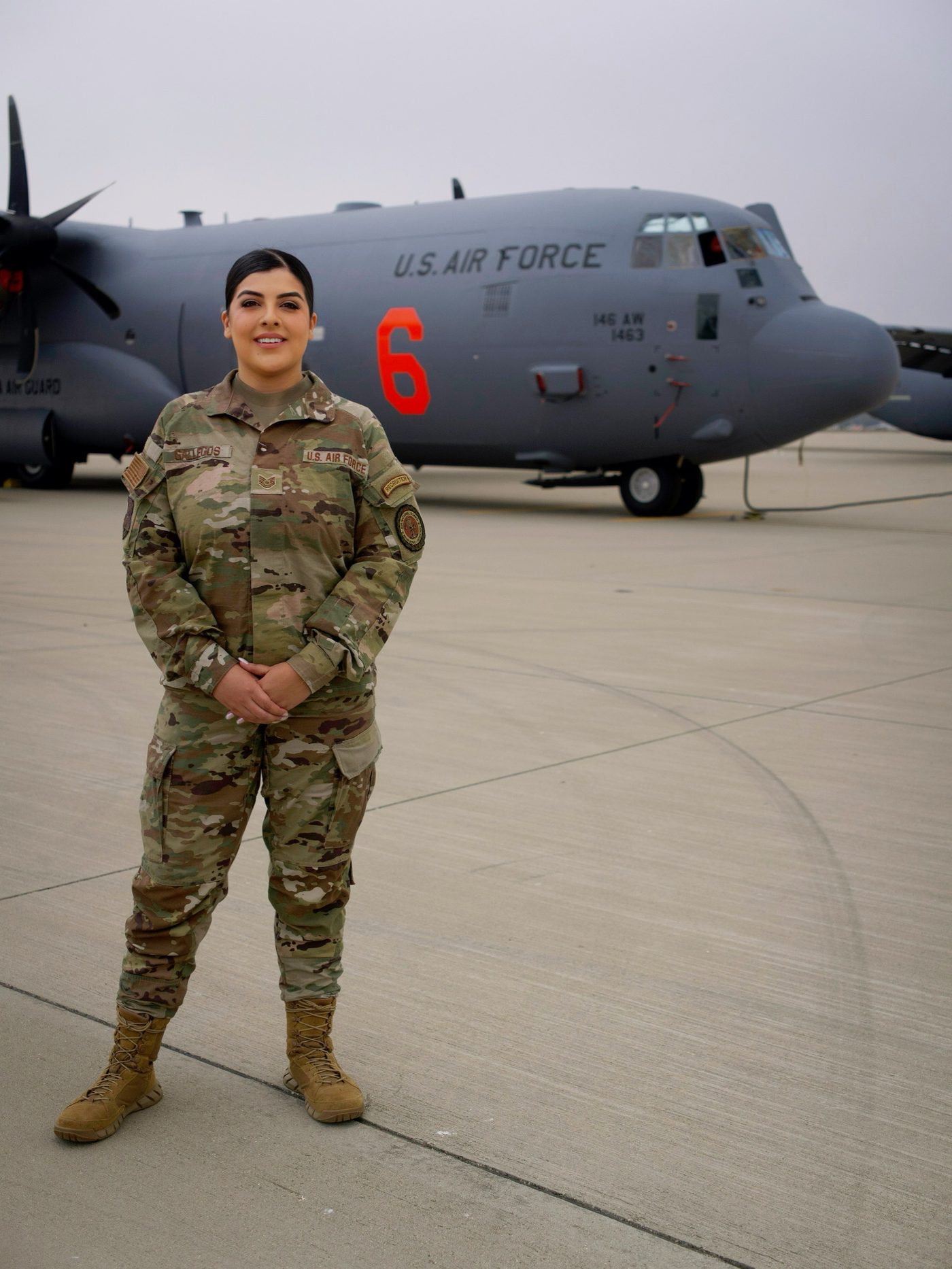 TSgt Jasmin Gallegos in front of a California Air National Guard C-130