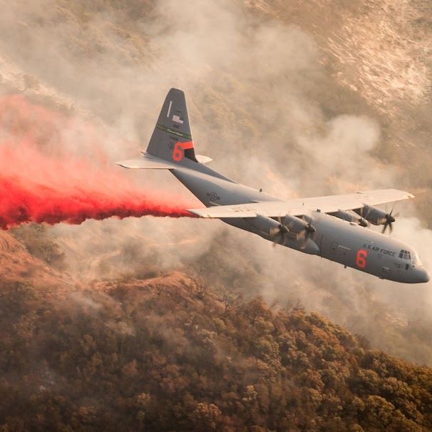 C-130 dropping fire retardant on a California wildfire